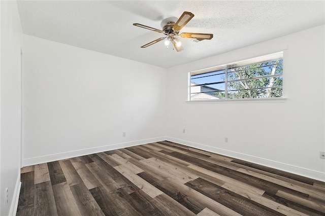 spare room featuring ceiling fan, a textured ceiling, and dark hardwood / wood-style floors