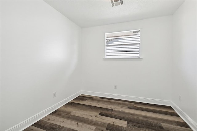 empty room with wood-type flooring