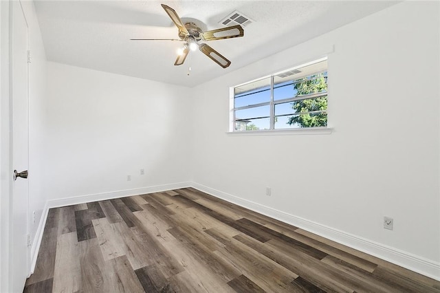 unfurnished room with ceiling fan and hardwood / wood-style flooring