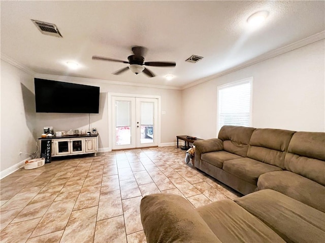 tiled living room with a textured ceiling, ceiling fan, french doors, and crown molding