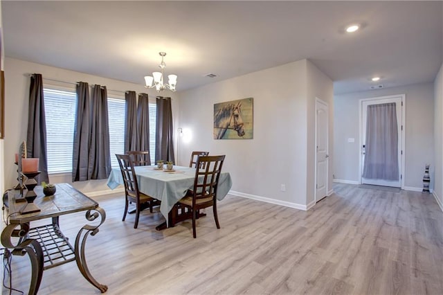 5572 Wake Reserve Rd, Slidell, LA 70461 - dining area featuring a chandelier, baseboards, light wood-style floors, and recessed lighting