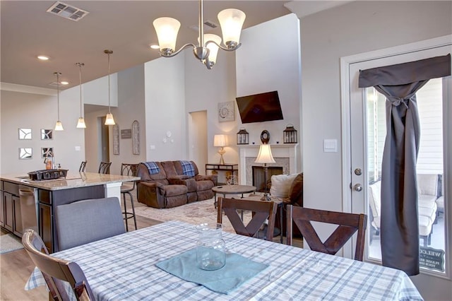 5572 Wake Reserve Rd, Slidell, LA 70461 - dining space with a chandelier and light wood-style floors