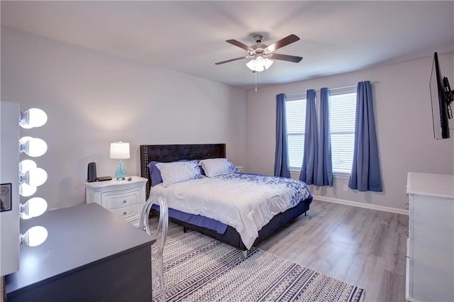 5572 Wake Reserve Rd, Slidell, LA 70461 - bedroom with light wood finished floors, baseboards, and a ceiling fan