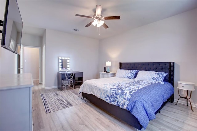 5572 Wake Reserve Rd, Slidell, LA 70461 - bedroom featuring light wood-style floors, baseboards, and ceiling fan