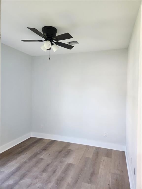 unfurnished room featuring ceiling fan and light hardwood / wood-style floors