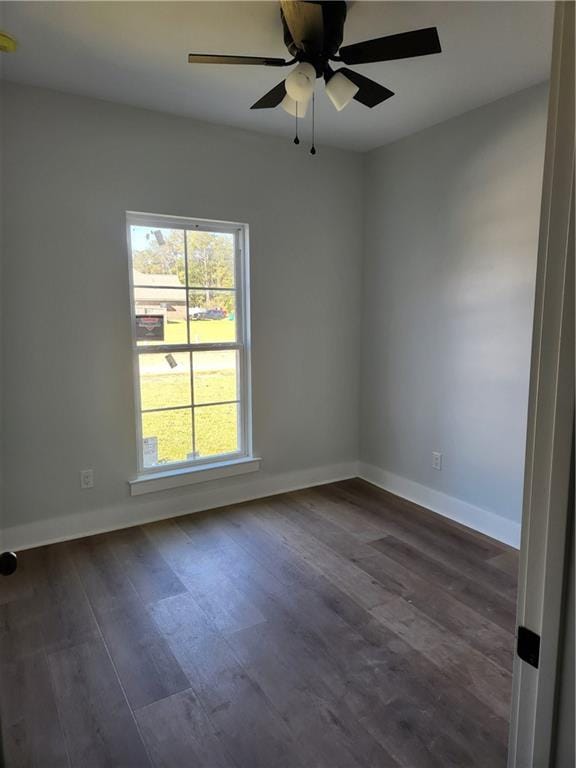 unfurnished room featuring dark hardwood / wood-style flooring and ceiling fan