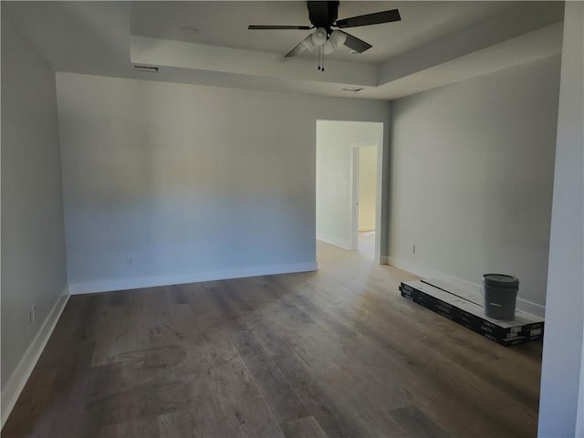 spare room with ceiling fan and hardwood / wood-style floors