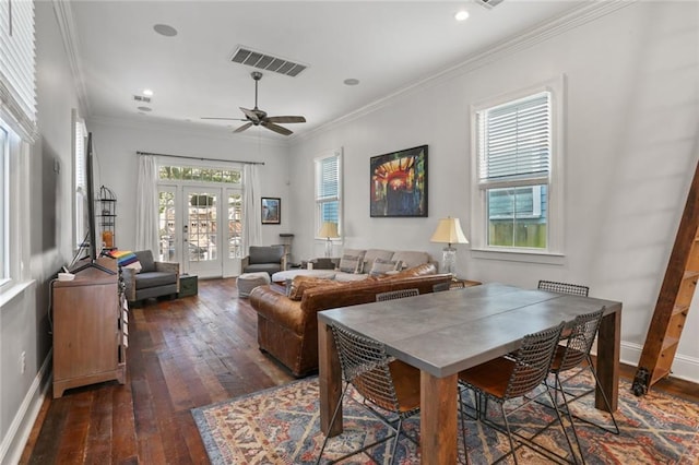 dining space featuring ceiling fan, crown molding, dark hardwood / wood-style flooring, and a healthy amount of sunlight