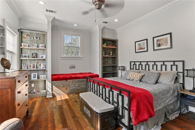 bedroom featuring ceiling fan, ornamental molding, and dark hardwood / wood-style flooring