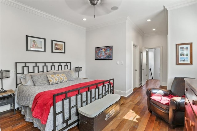 bedroom with ornamental molding, ceiling fan, and dark hardwood / wood-style floors