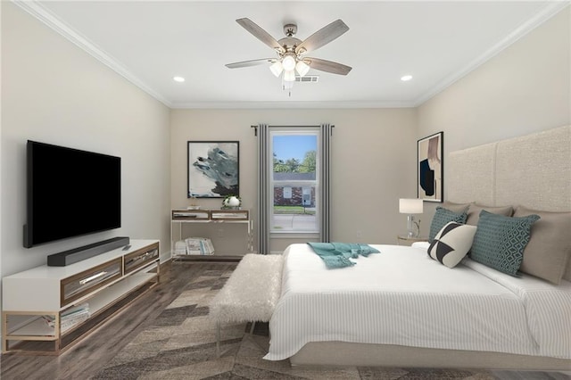 bedroom with ceiling fan, crown molding, and dark wood-type flooring