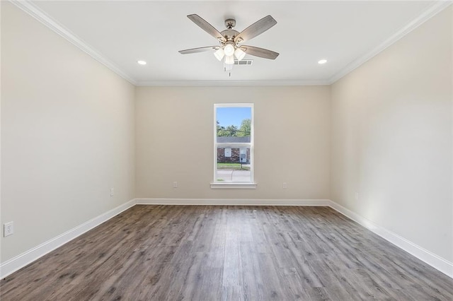 empty room featuring ceiling fan, crown molding, and wood-type flooring