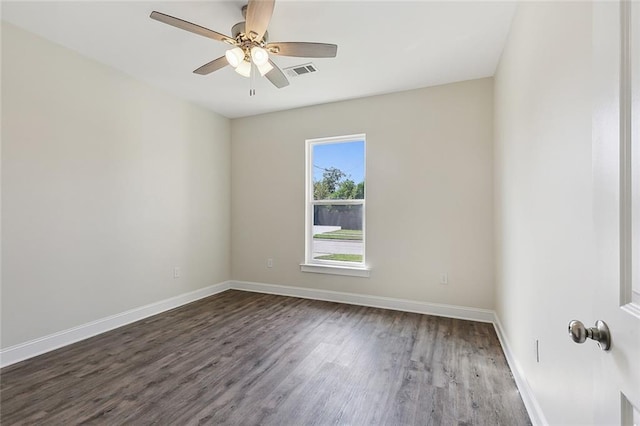 unfurnished room with dark hardwood / wood-style floors and ceiling fan