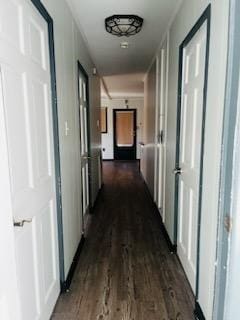 hallway featuring dark hardwood / wood-style floors