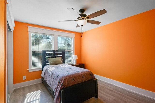 bedroom featuring hardwood / wood-style flooring and ceiling fan