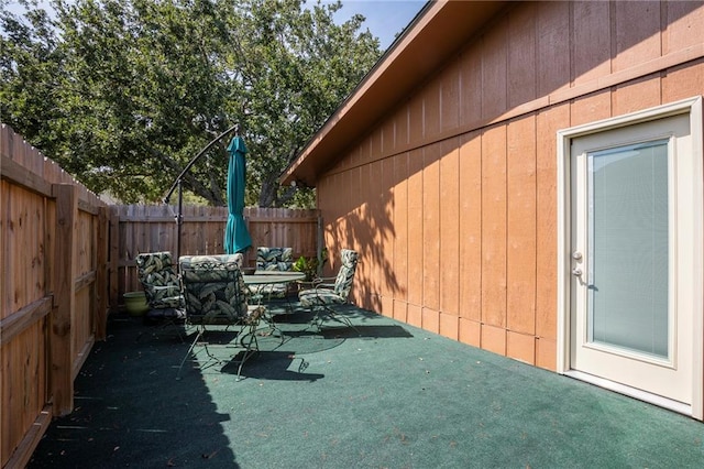 view of side of home featuring a patio area