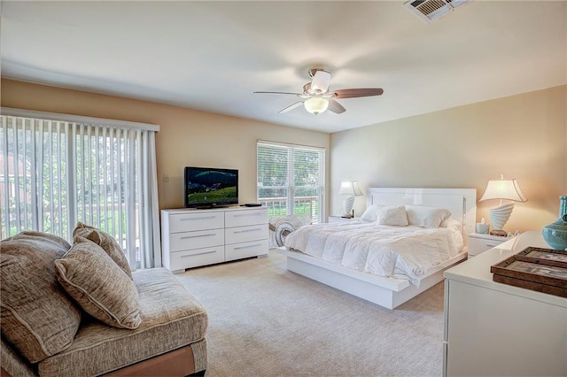 carpeted bedroom featuring ceiling fan