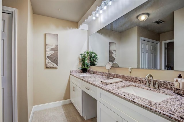 213 Surrey Dr, La Place, LA 70068 - full bathroom with baseboards and double vanity