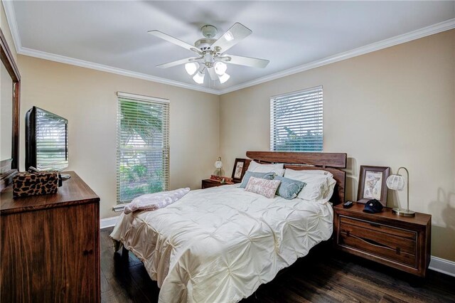 bedroom with ceiling fan, crown molding, and dark wood-type flooring