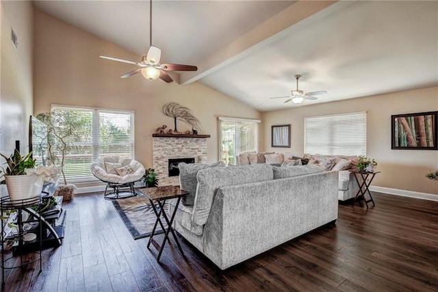 living room with ceiling fan, a fireplace, lofted ceiling with beams, and dark wood-type flooring