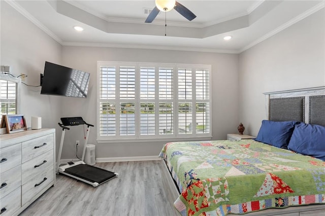 bedroom with ceiling fan, crown molding, and multiple windows