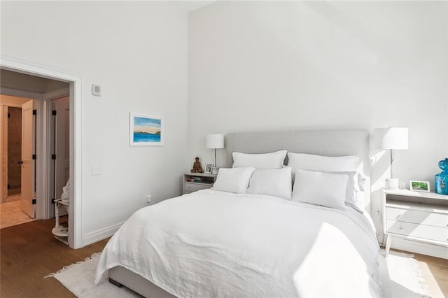 bedroom featuring dark wood-type flooring