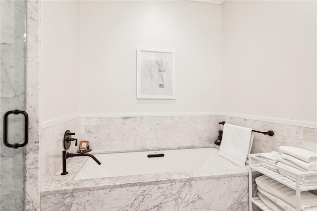 bathroom featuring separate shower and tub