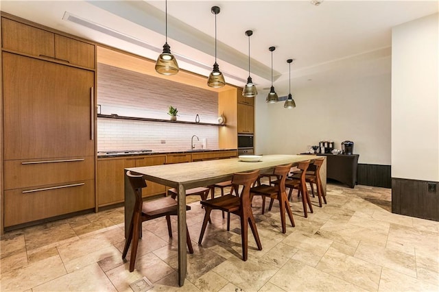 dining space featuring sink