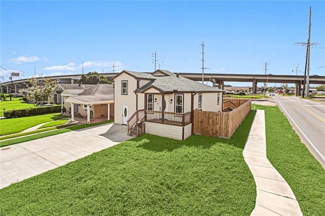 view of front of house featuring a front yard and a porch