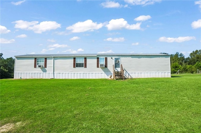 manufactured / mobile home featuring cooling unit and a front yard