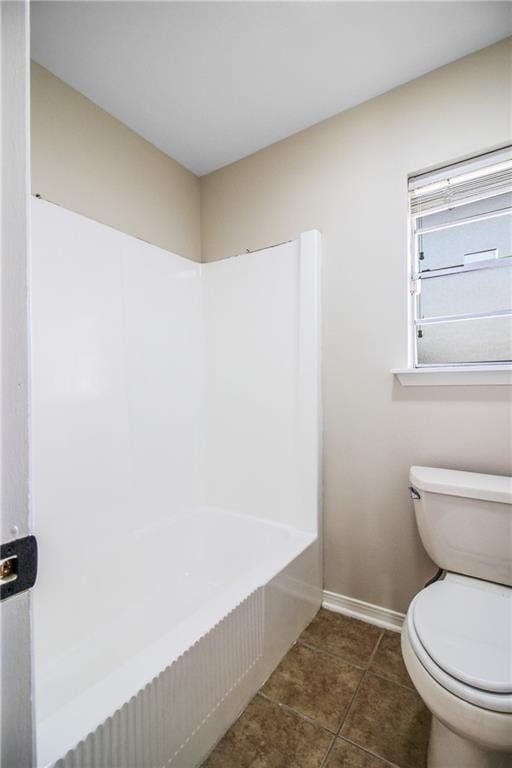 bathroom with tile patterned floors and toilet