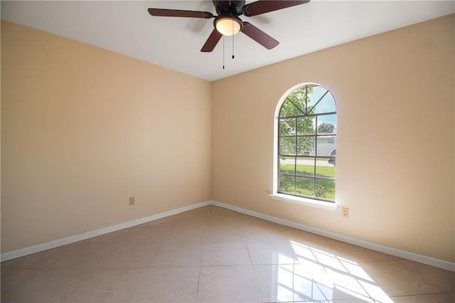 unfurnished room featuring light tile patterned floors and ceiling fan