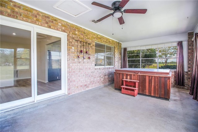 view of patio featuring a hot tub and ceiling fan