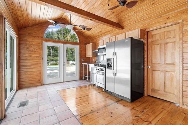 kitchen featuring stainless steel appliances, ceiling fan, light brown cabinets, and french doors