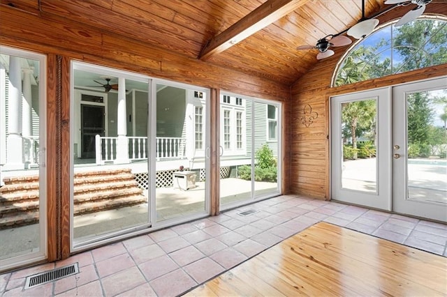 doorway with vaulted ceiling with beams, a healthy amount of sunlight, and ceiling fan