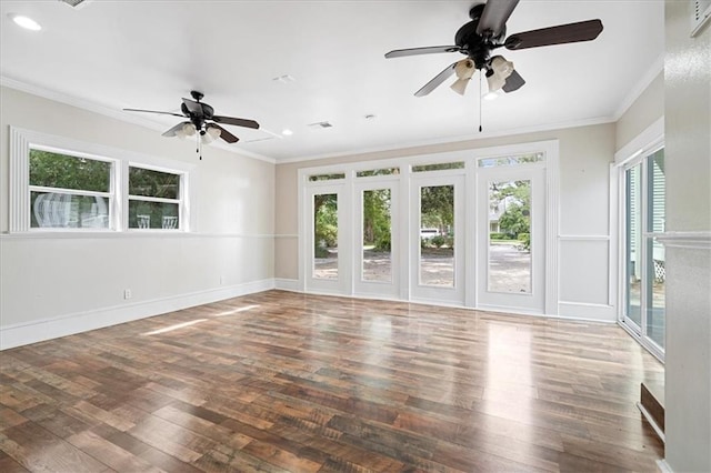 unfurnished room with ceiling fan, crown molding, and dark wood-type flooring