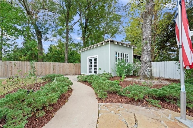 view of yard with a patio area and an outbuilding