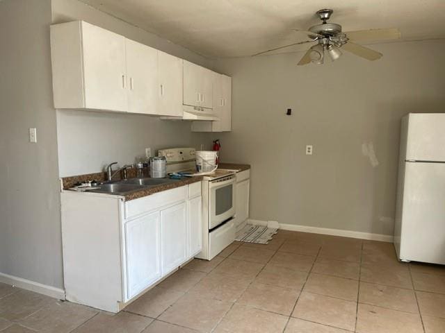 kitchen with white cabinets, white appliances, light tile patterned floors, ceiling fan, and sink