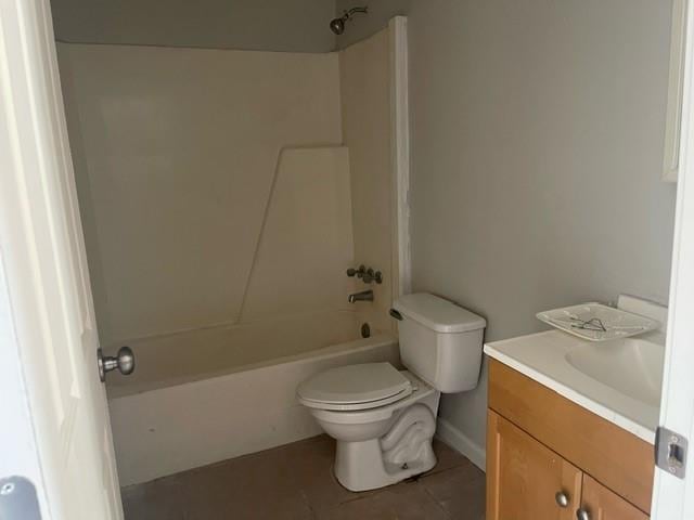 full bathroom with tile patterned floors,  shower combination, vanity, and toilet