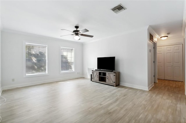 unfurnished living room with light wood-type flooring, ceiling fan, and crown molding