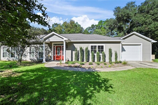 ranch-style home with a front yard and a garage