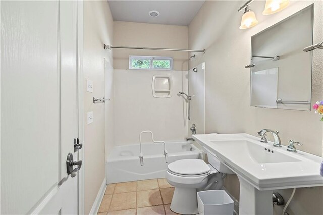 bathroom featuring toilet, bathing tub / shower combination, and tile patterned floors