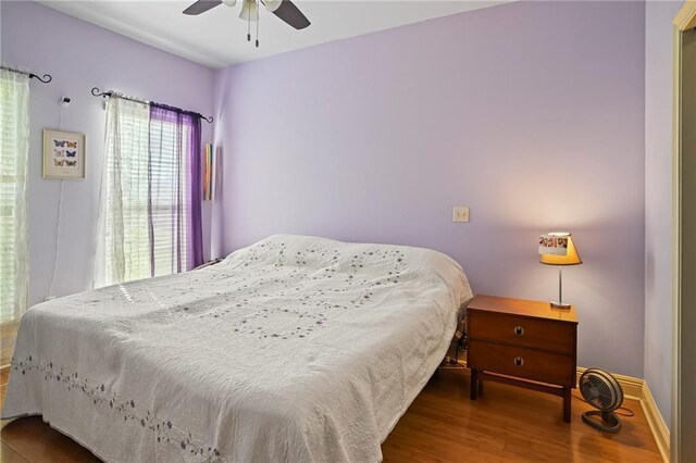 bedroom featuring ceiling fan and wood-type flooring