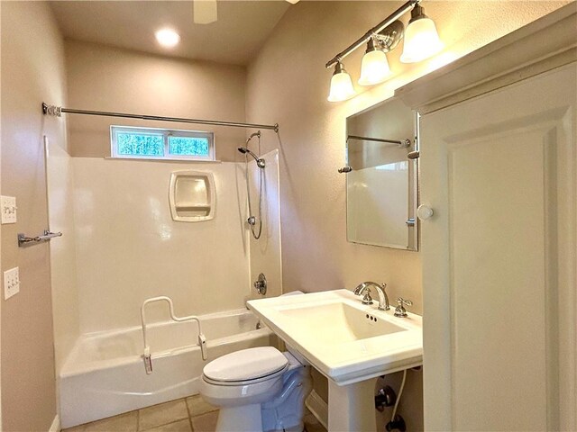 bathroom featuring shower / bathtub combination, tile patterned floors, and toilet