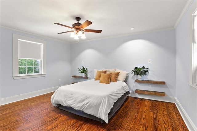 bedroom with ceiling fan, ornamental molding, and dark hardwood / wood-style flooring