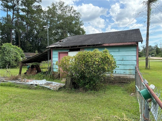 view of property exterior with a yard