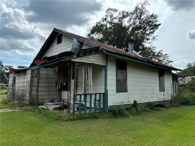 view of property exterior with a lawn