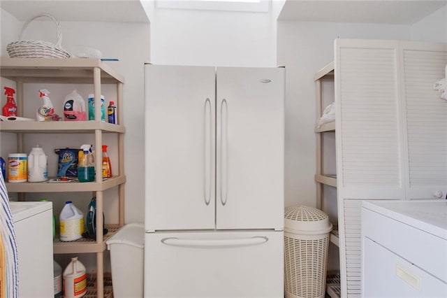 interior space featuring vanity, toilet, and washer / dryer