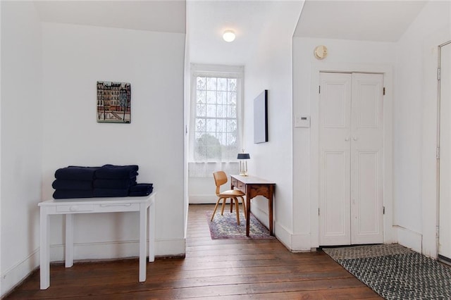 foyer with dark hardwood / wood-style floors