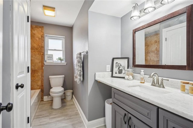 full bathroom featuring hardwood / wood-style floors, shower / bath combination, vanity, and toilet